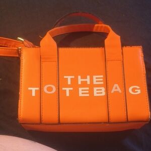 Toteme Orange Tote Bag with White Lettering